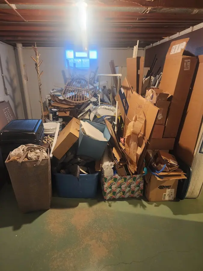 Roll-off dumpster container at job site for 15 Yard Dumpster Rental in Angier