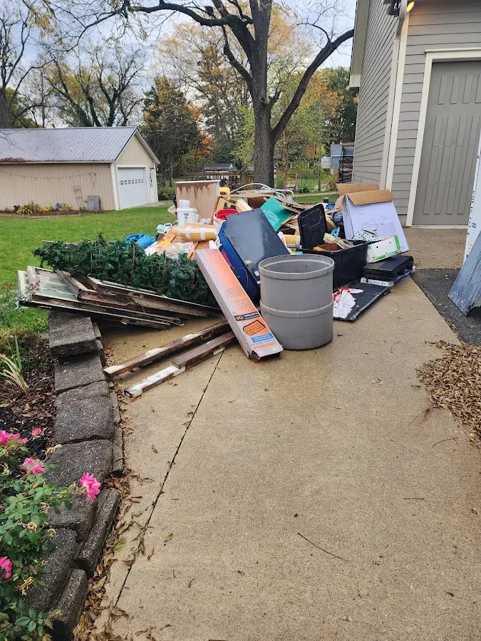 Dumpster being loaded with debris for Residential Dumpster Rental in Angier
